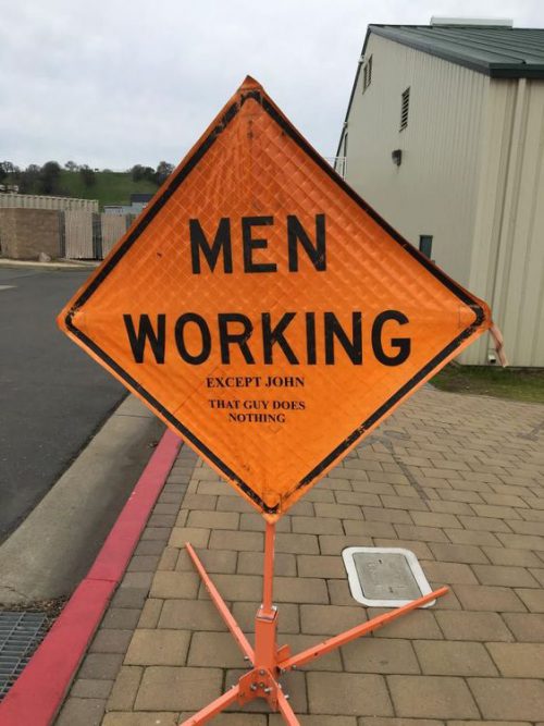 men working except John